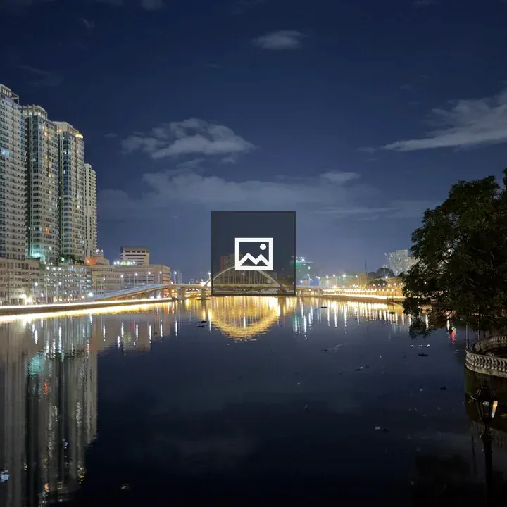 Night cityscape with river and bridge