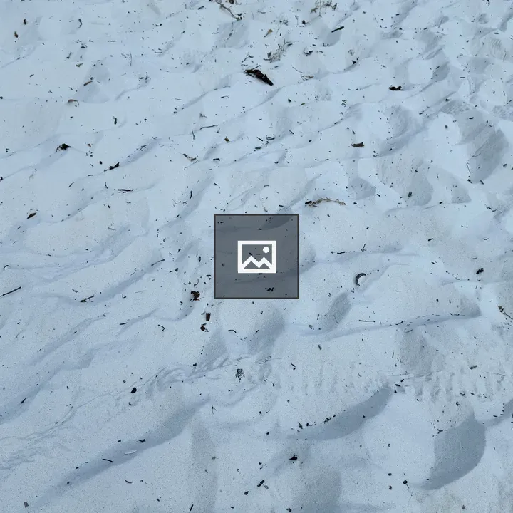Top view of beach sand with footprints