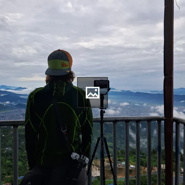 Person at Viewpoint Overlooking Mountains
