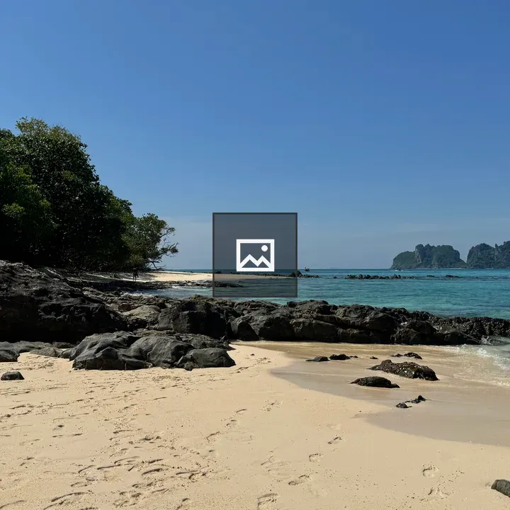 Tropical coastline with rocks and island