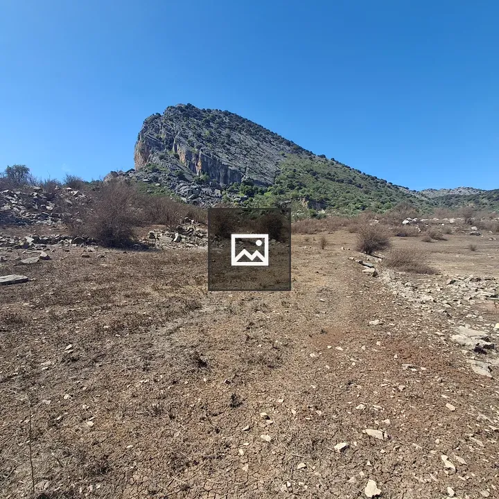 Rocky landscape with blue sky and hills