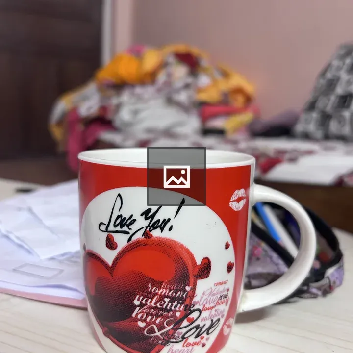 Red coffee mug on white table