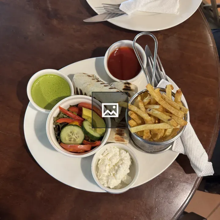 Plate with wrapped sandwich and fries