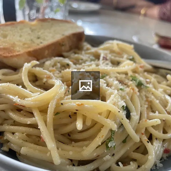 White spaghetti with cheese and herbs