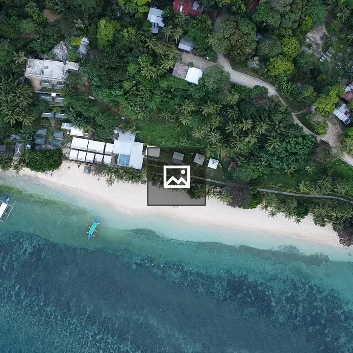 Drone shot of white sand beach resort