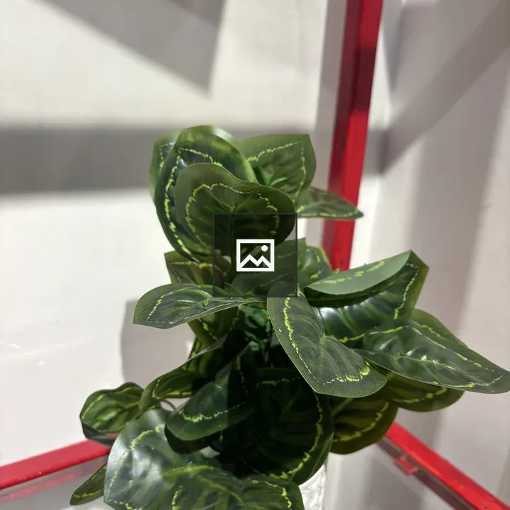Potted artificial plant with variegated leaves