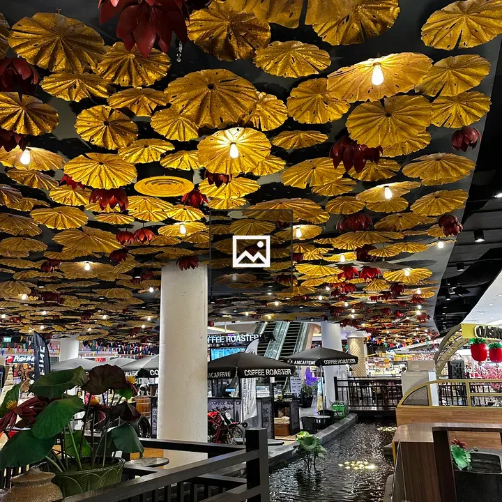 Flower-shaped lights over water feature