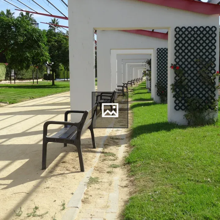 Pathway with White Pergolas