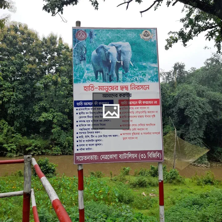 Sign on Fence by the River