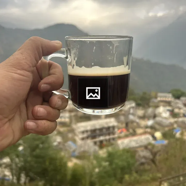 Coffee Being Held by a Hand