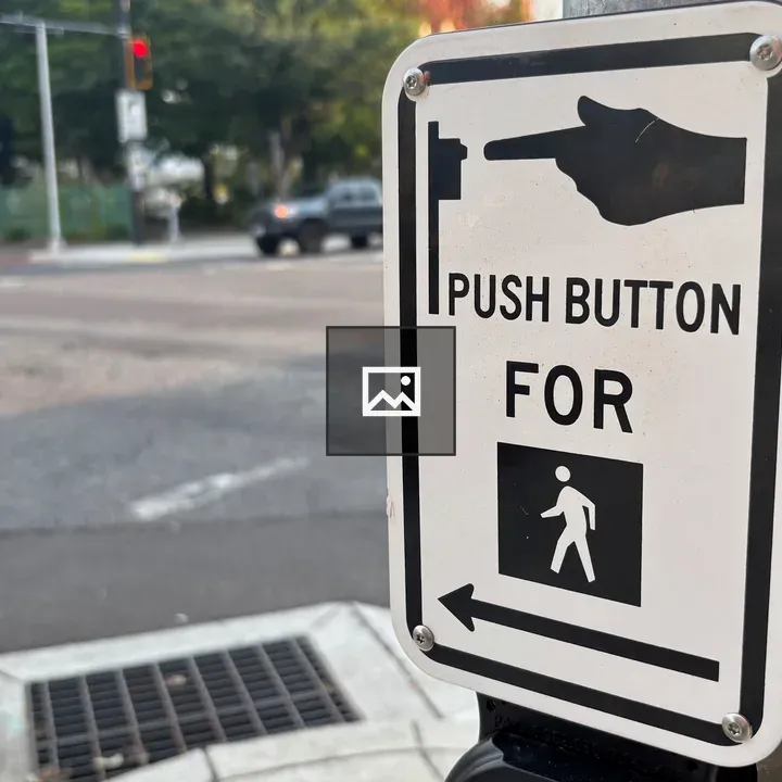 Push button sign on post