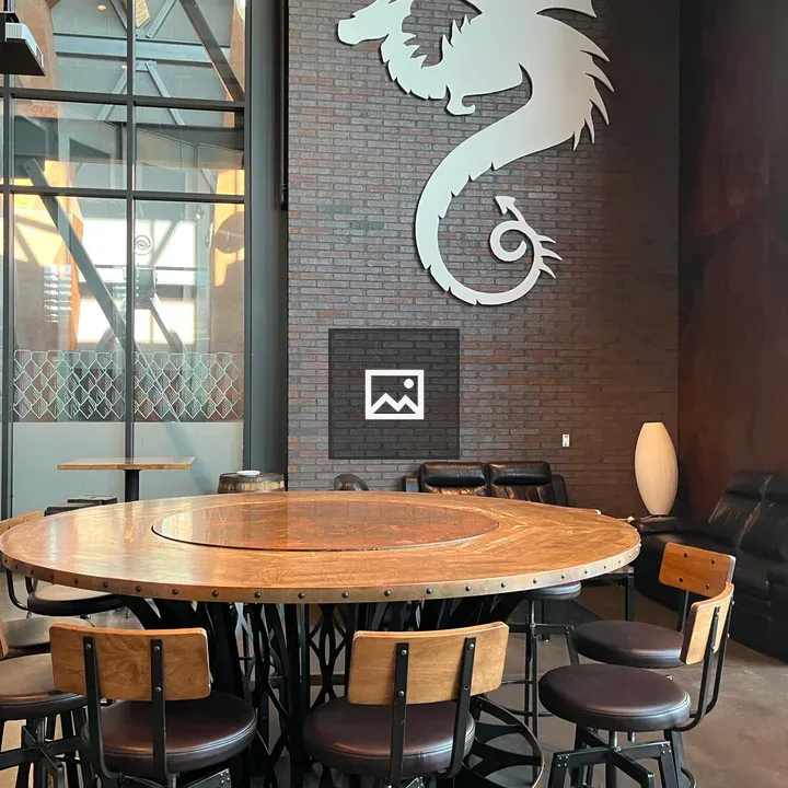 Round Wooden Table with Dragon Wall