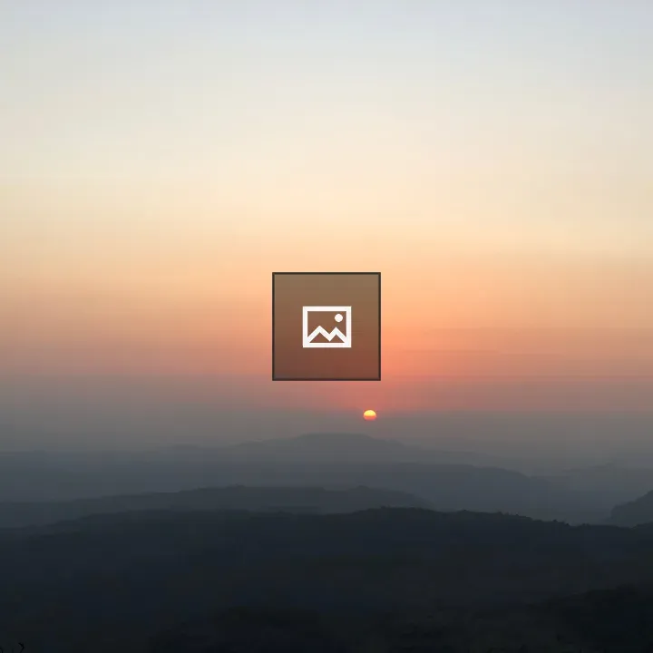 Sunset Over Mountain Silhouettes