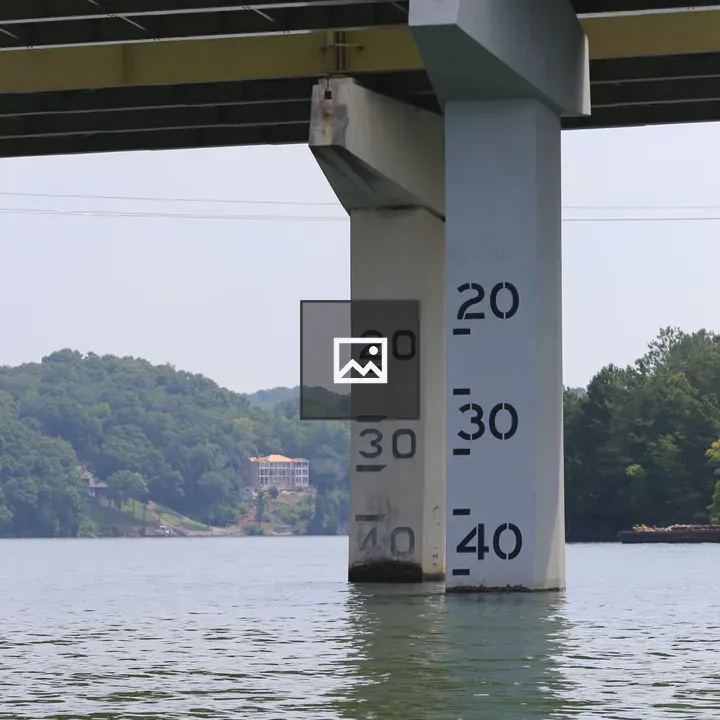 Bridge clearance markers on highway pylon