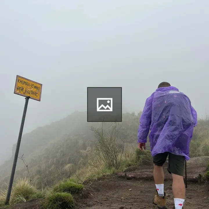 Hiker in Purple Rain Poncho