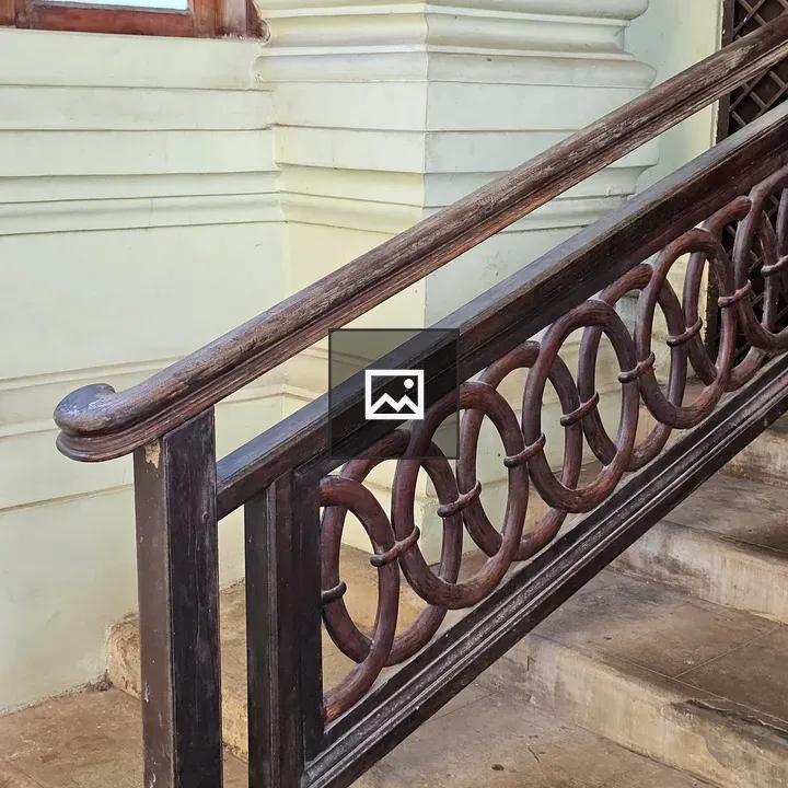 Polished wooden staircase handrail
