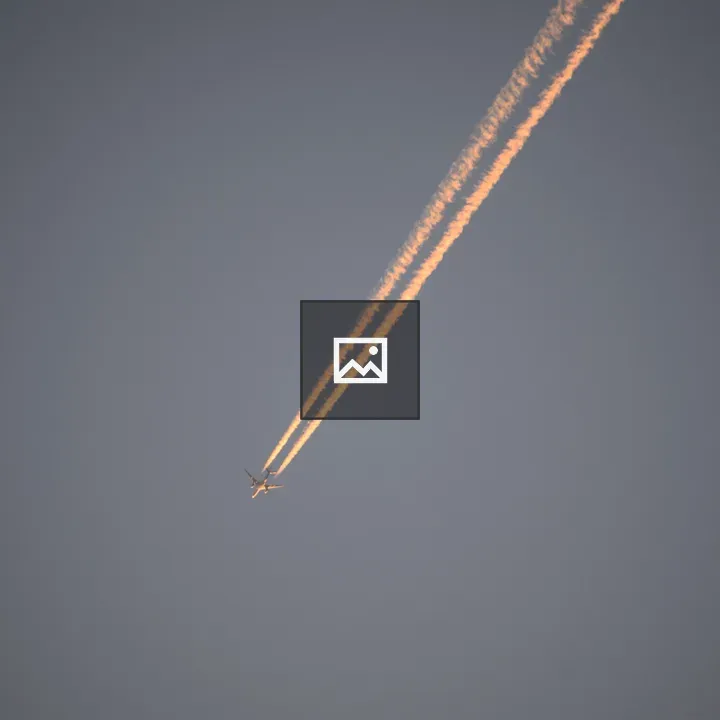 Passenger plane against blue sky