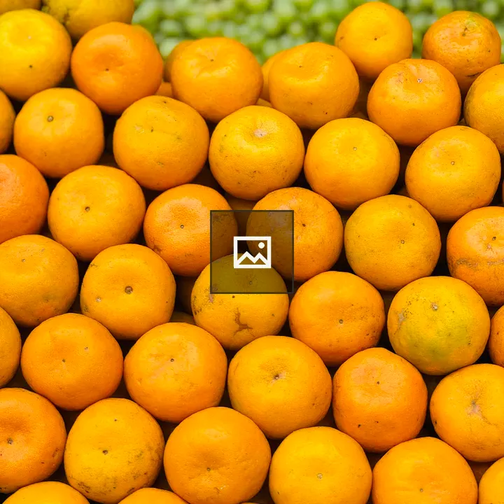 Oranges stacked close together