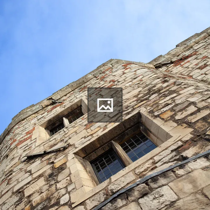 Old Building Windows Under Blue Sky
