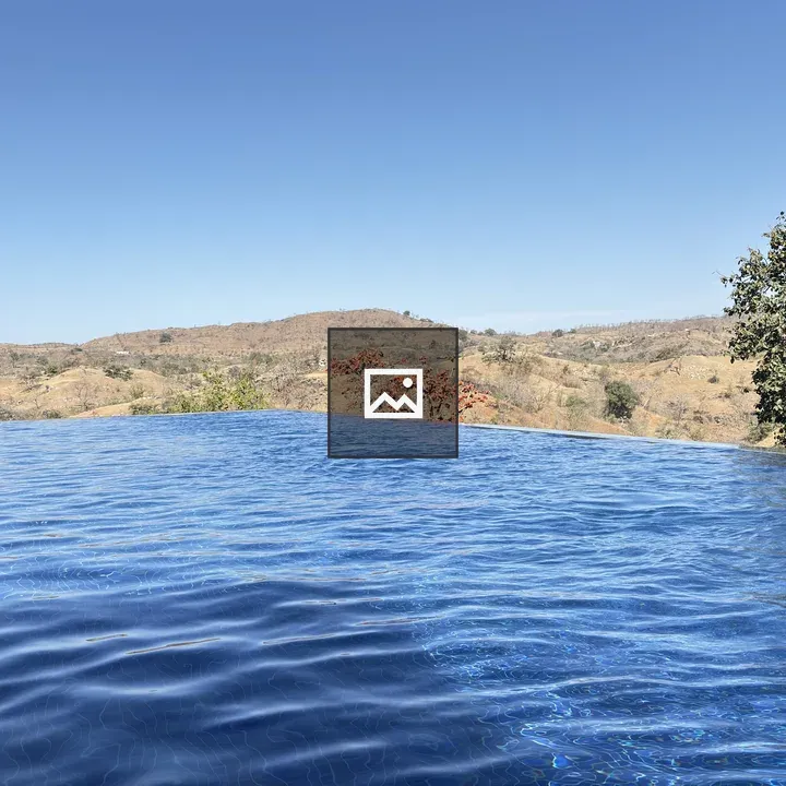 Infinity pool overlooking dry hills