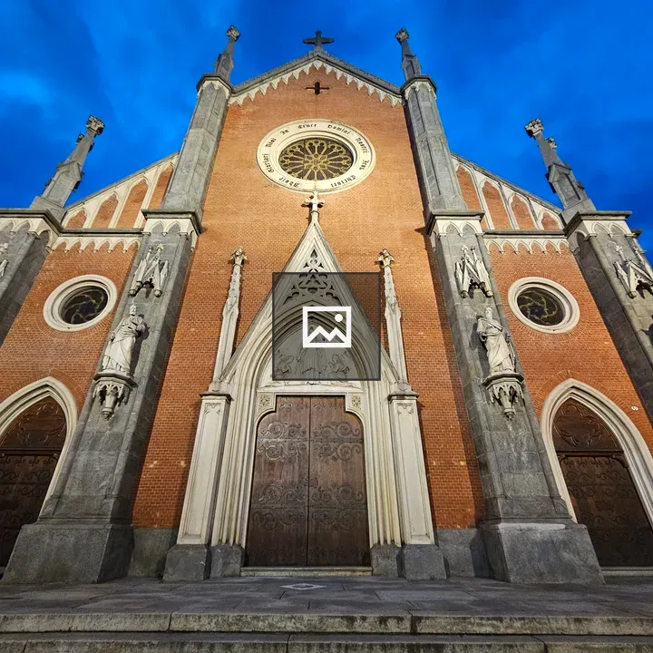 Facade of Santa Giulia church at night