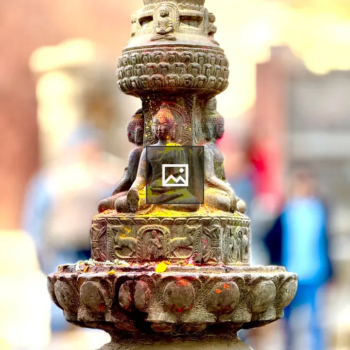 Stone Buddha Sculpture with Festive Powder