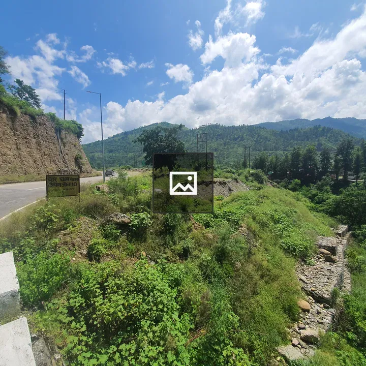Curvy road through green hills