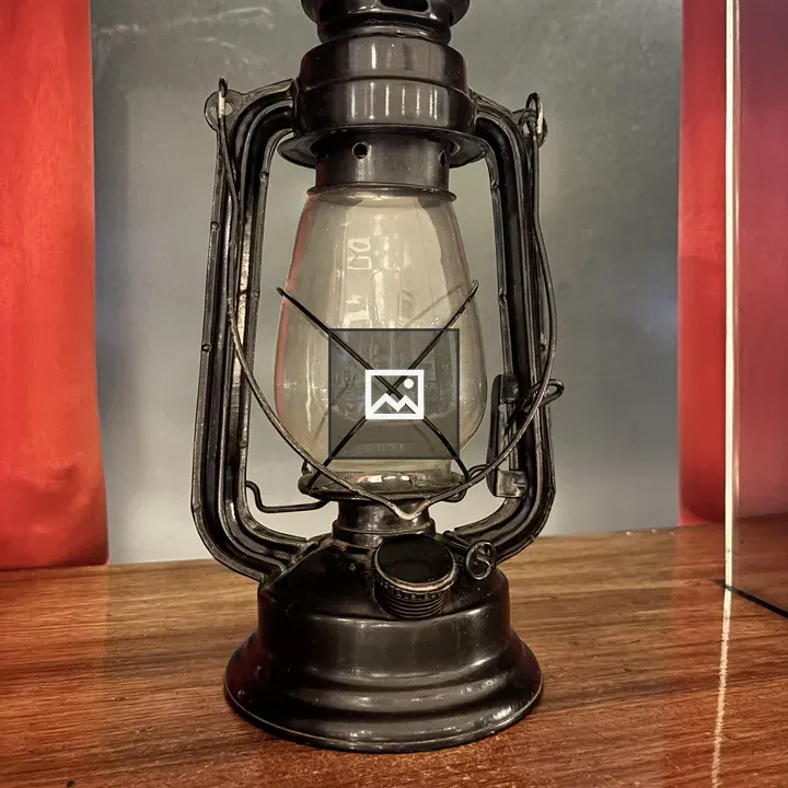 Vintage oil lantern on wood