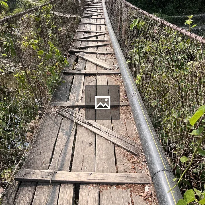 Weathered wooden suspension bridge