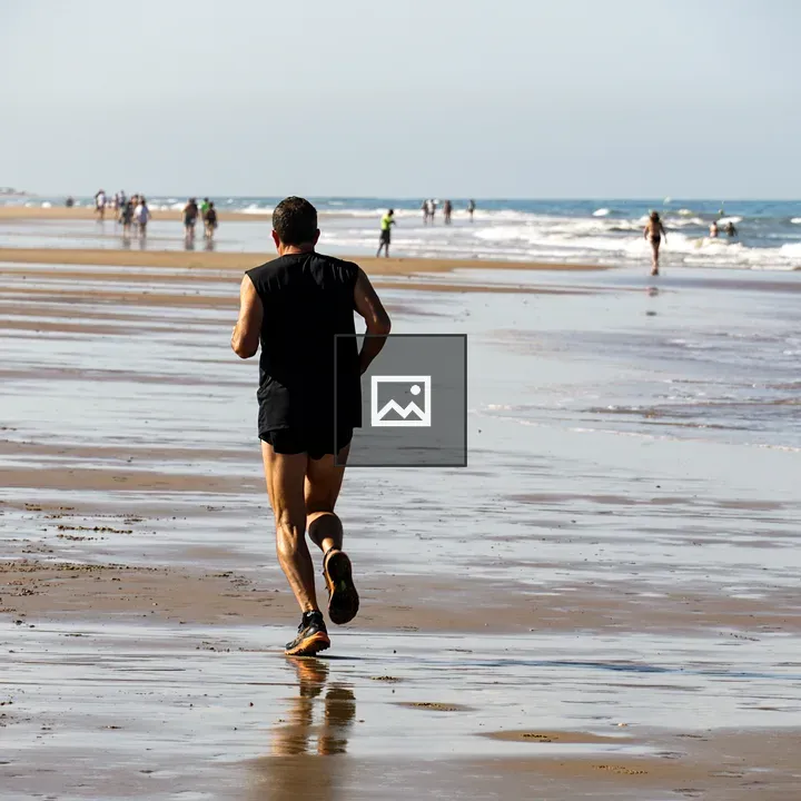 Person Jogging on Beach