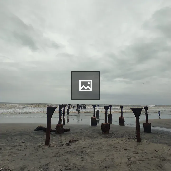 Seascape with rusted bridge supports