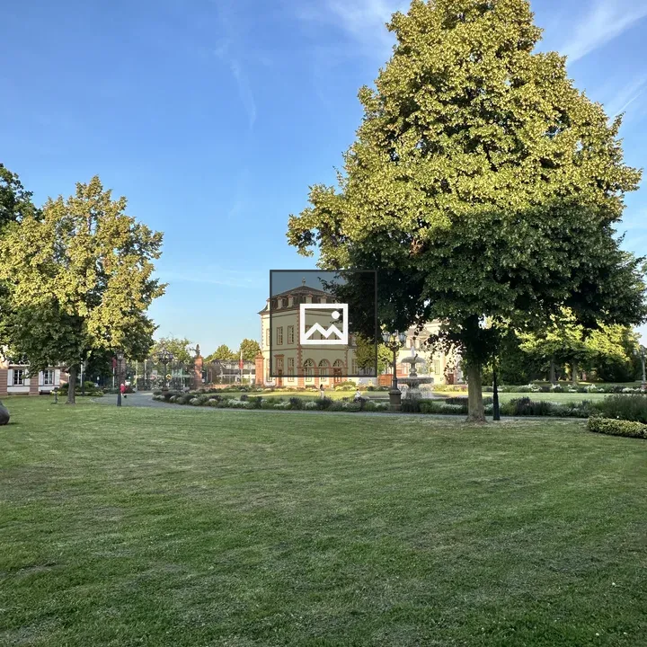 Historic building in sunlit park