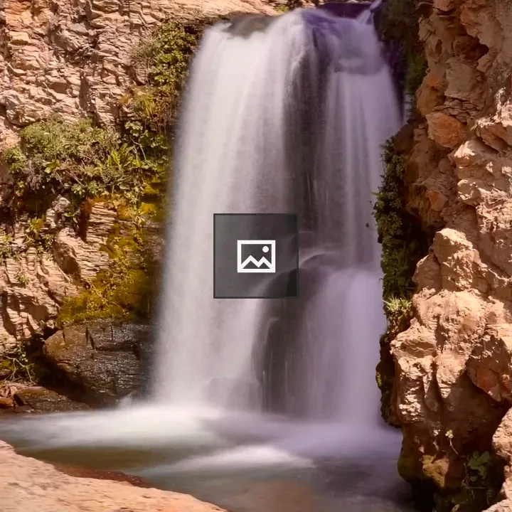 Natural waterfall in rocky canyon