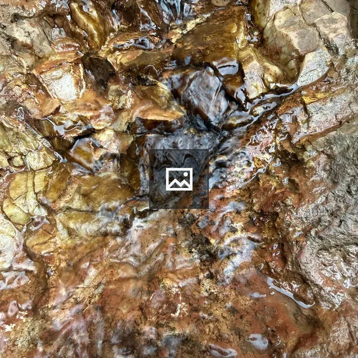 Water over golden stone