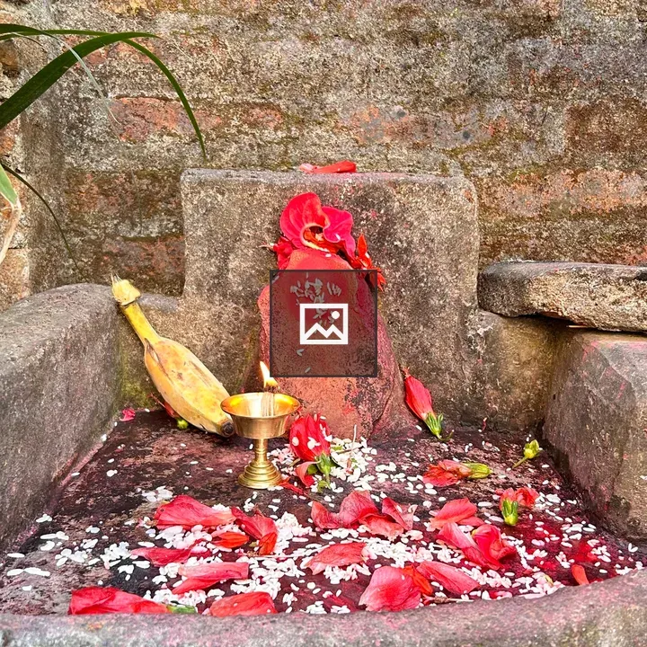 Stone altar with petals and lamp