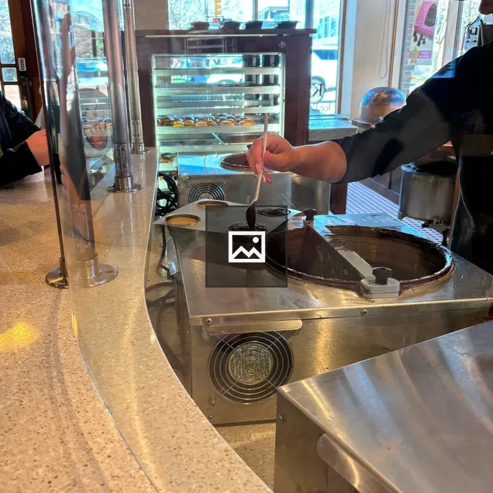Person Hand Making Peanut Butter Cup Confections