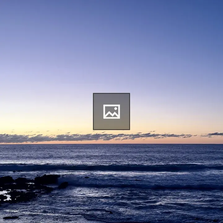 Sunset over water on a beach