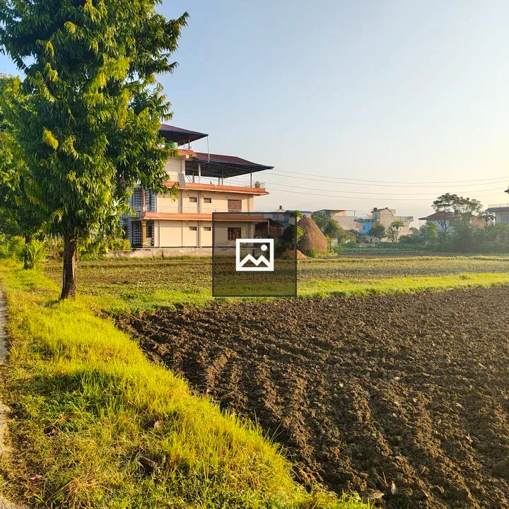 House Beside Plowed Field