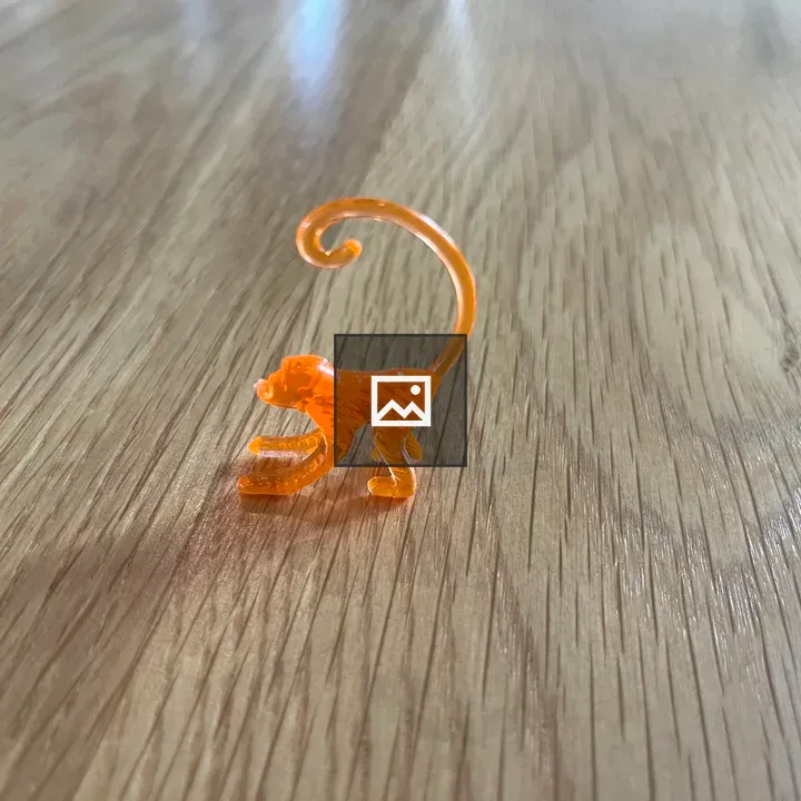 Toy Monkey on Floor