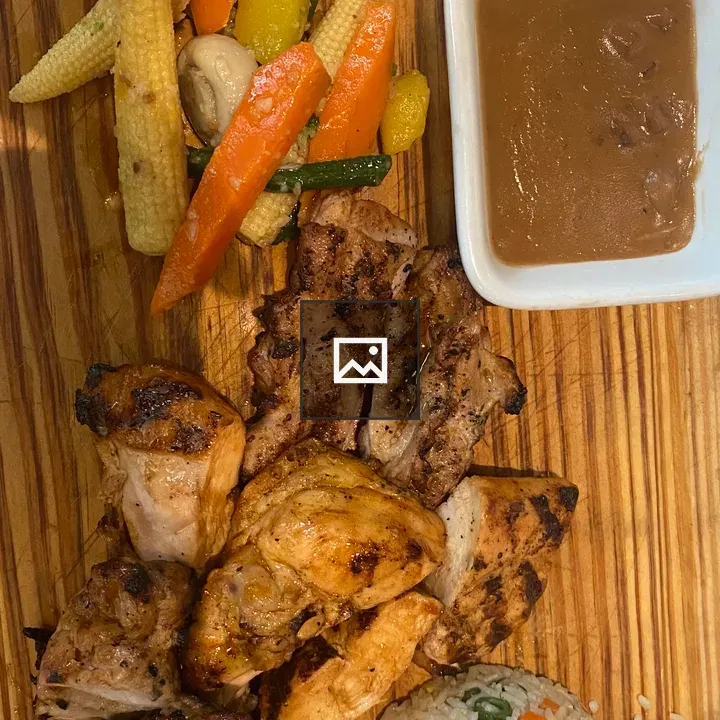 Grilled chicken meal on board