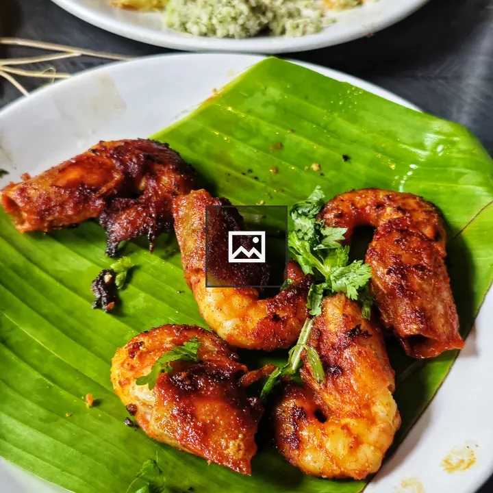 Grilled prawns on green banana leaf