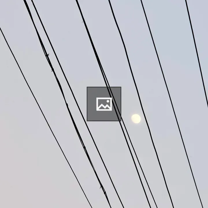 Moon over power lines