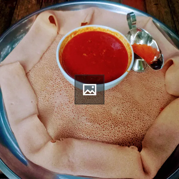 Injera with Red Sauce on Tray