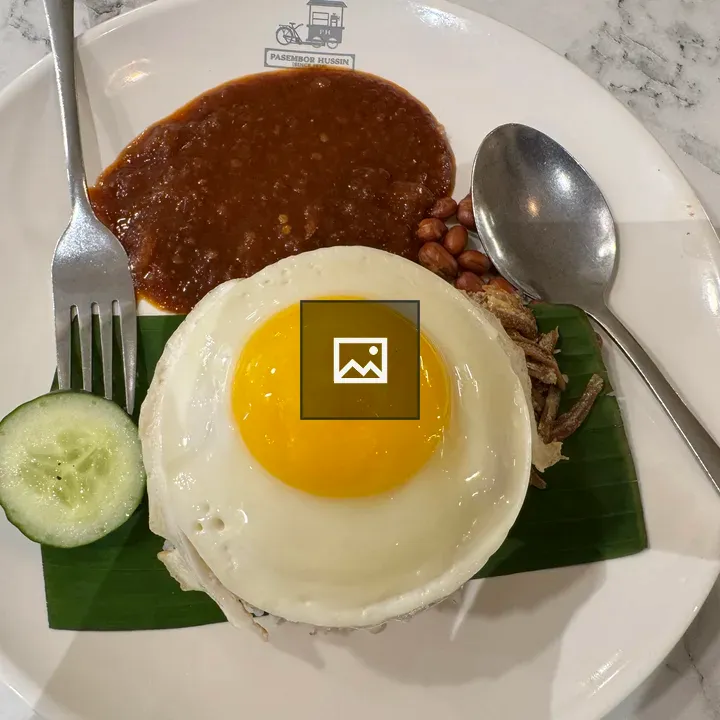 Plated fried egg over rice