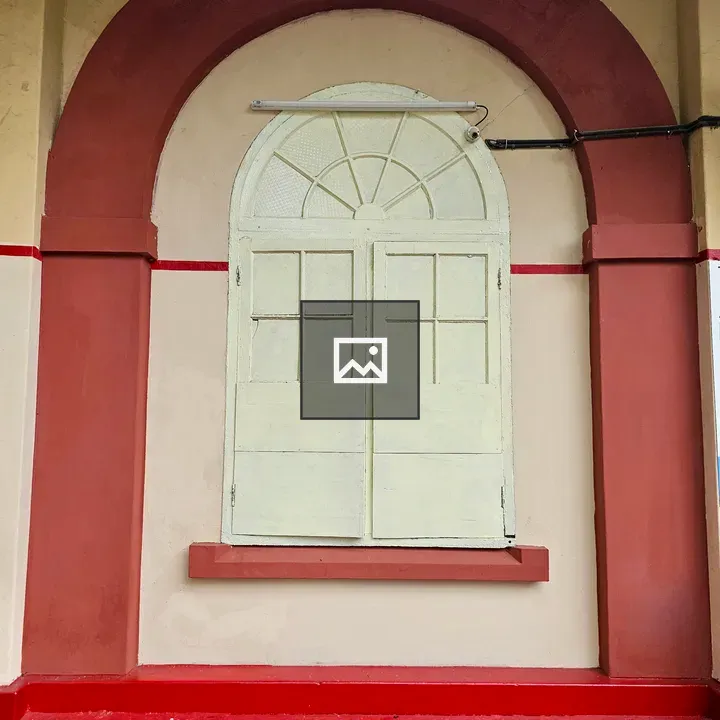 Arched vintage window on wall