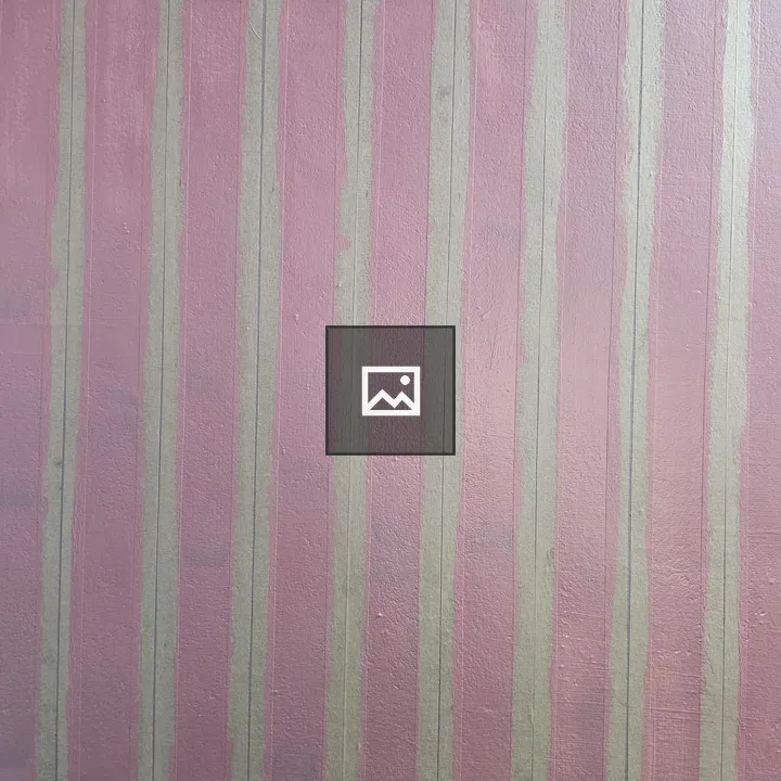 Pink textured wall with masking tape