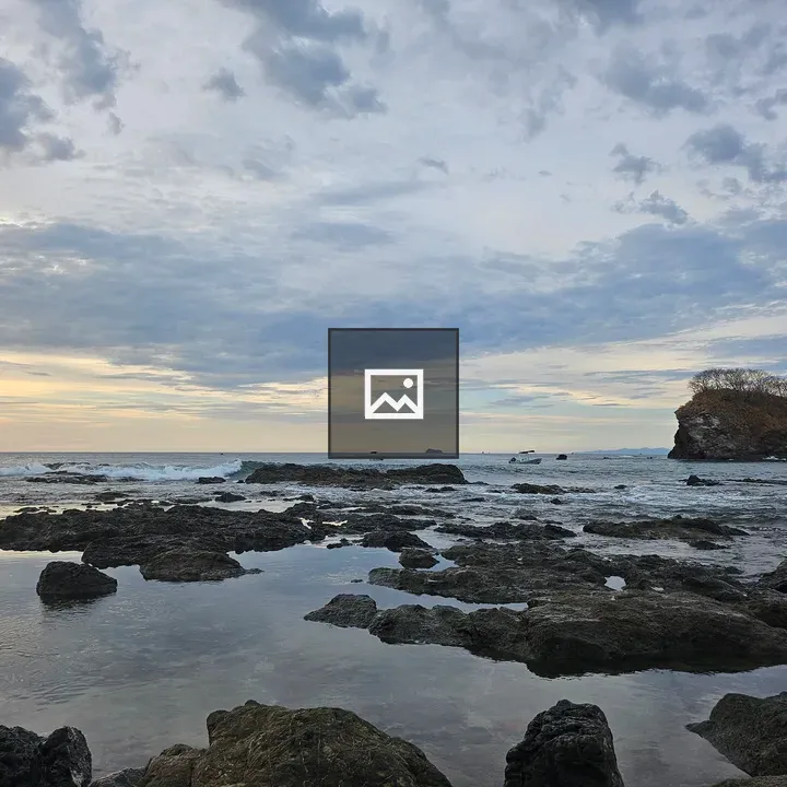 Rocky beach at sunset with lava formations