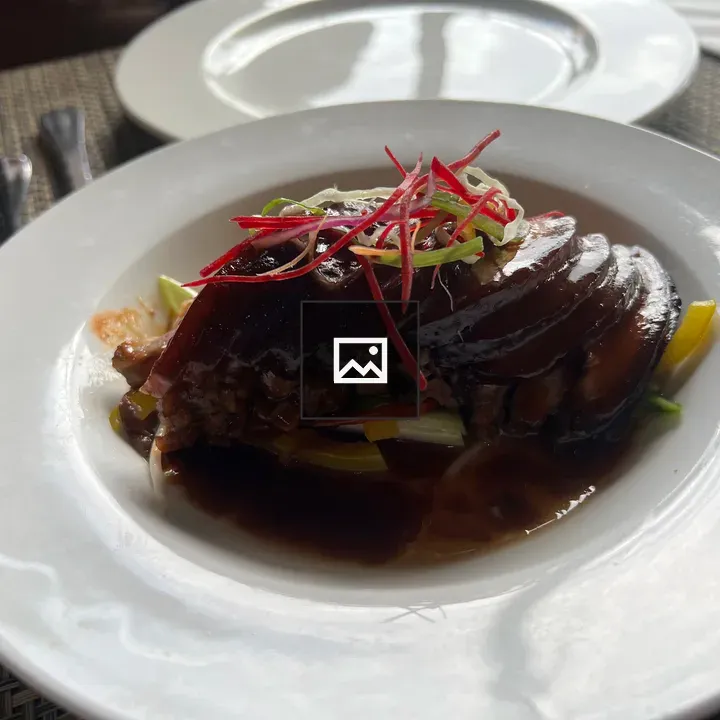 Savory pork belly dish close-up