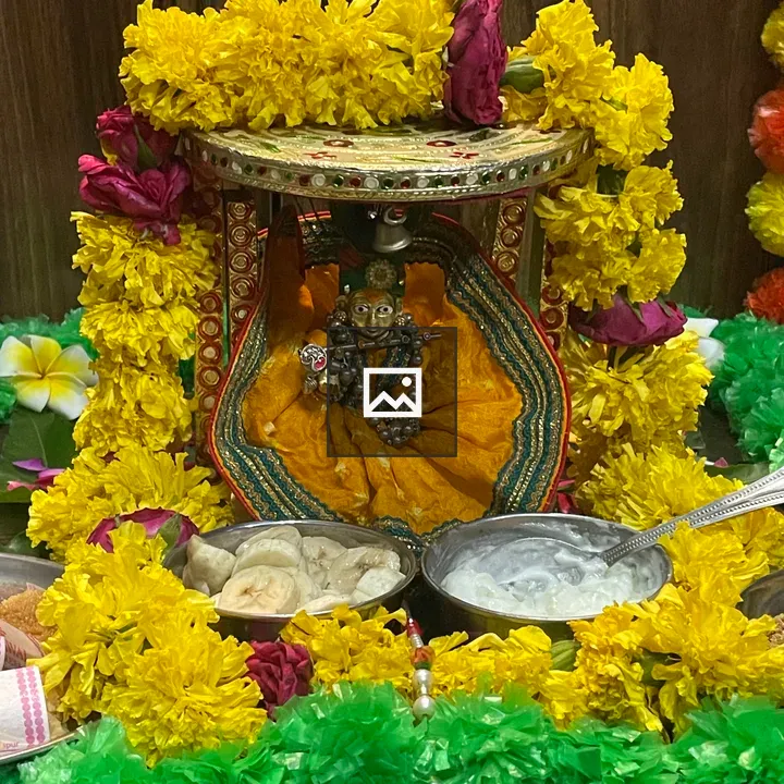 Idol of Krishna in Yellow Attire