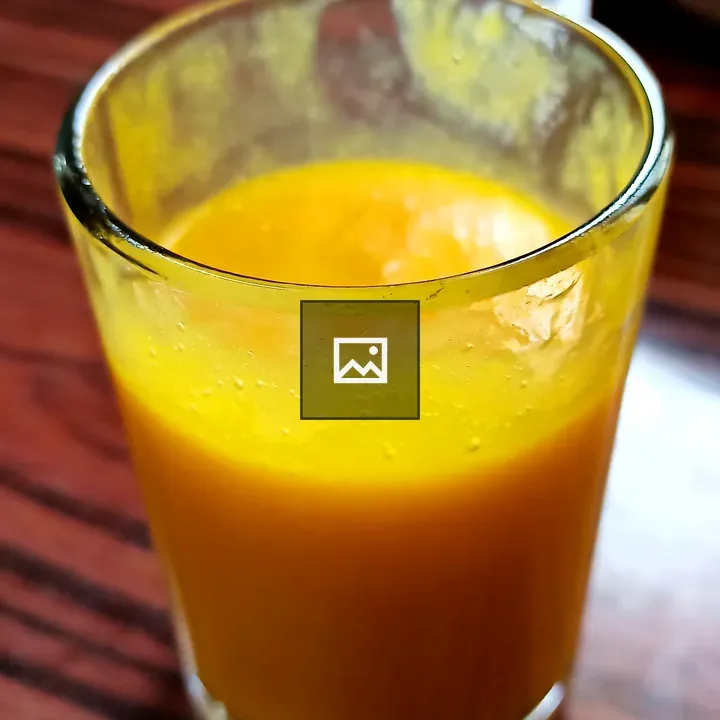 Mango juice in a crystal glass